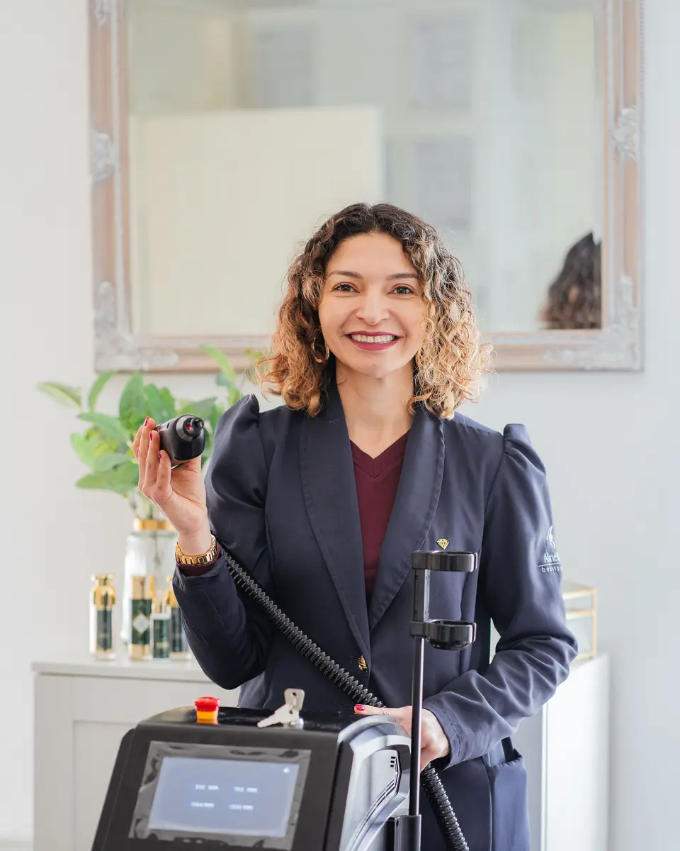 Aline Brito with treatment equipment in her clinic
